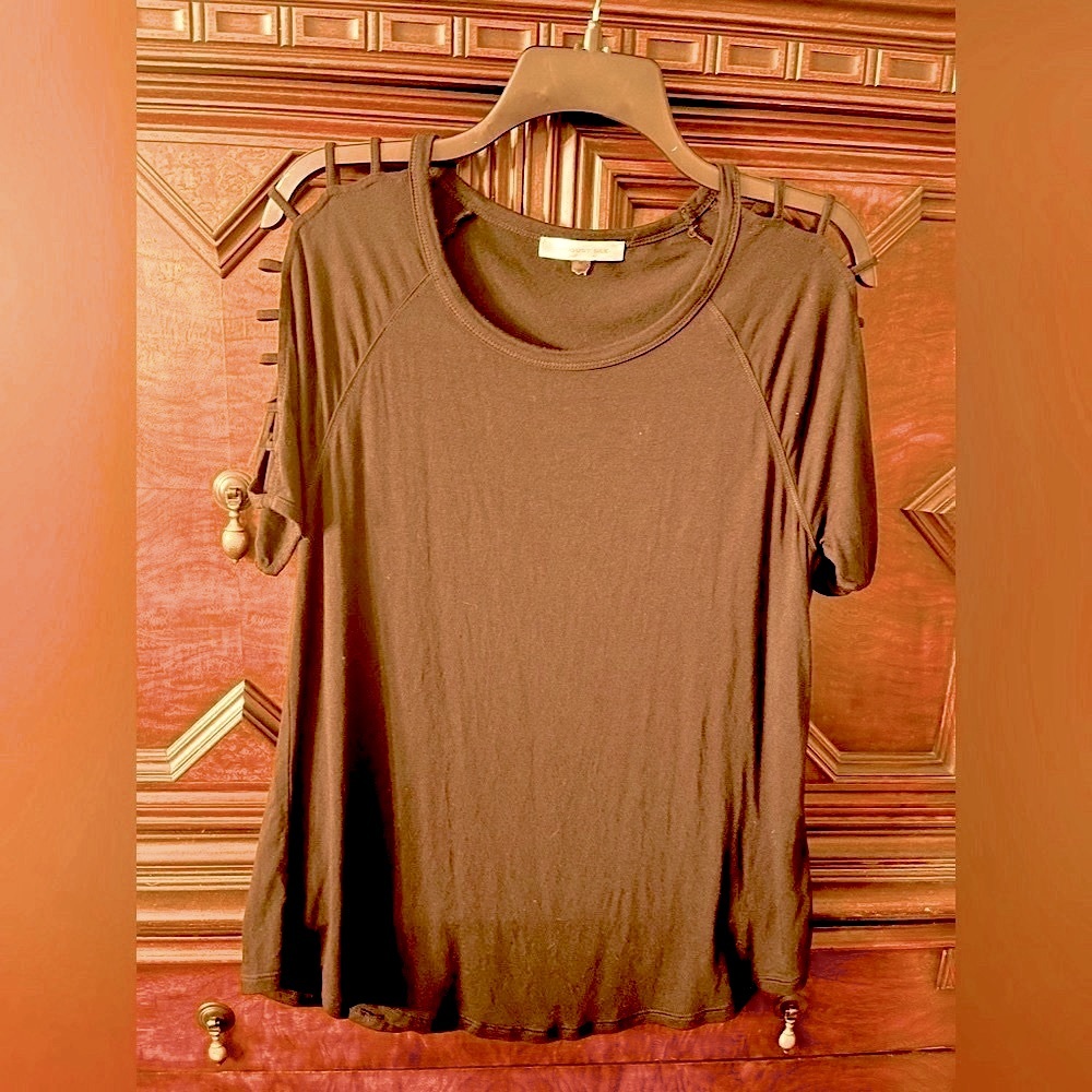 August Silk top.  Black with ladder sleeve cut outs.  Soft. Size M.  Excellent.